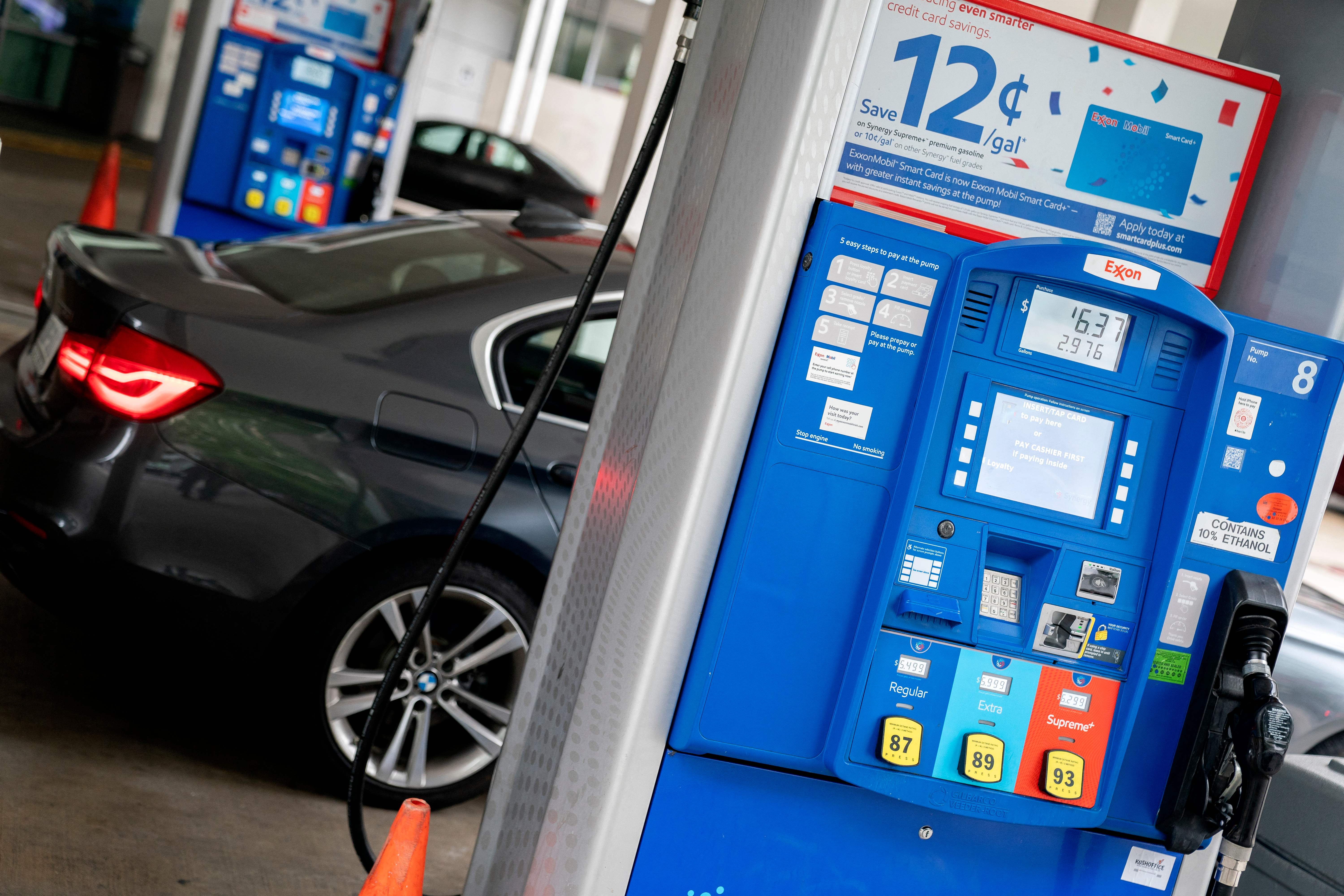 Prices are displayed on a gas pump outside of a gas station in Washington, DC, on June 14, 2022