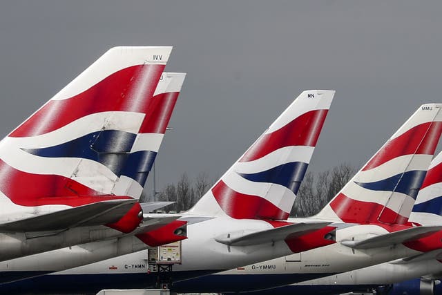 <p>British Airways planes at London Heathrow, where passenger service agents have voted to strike </p>