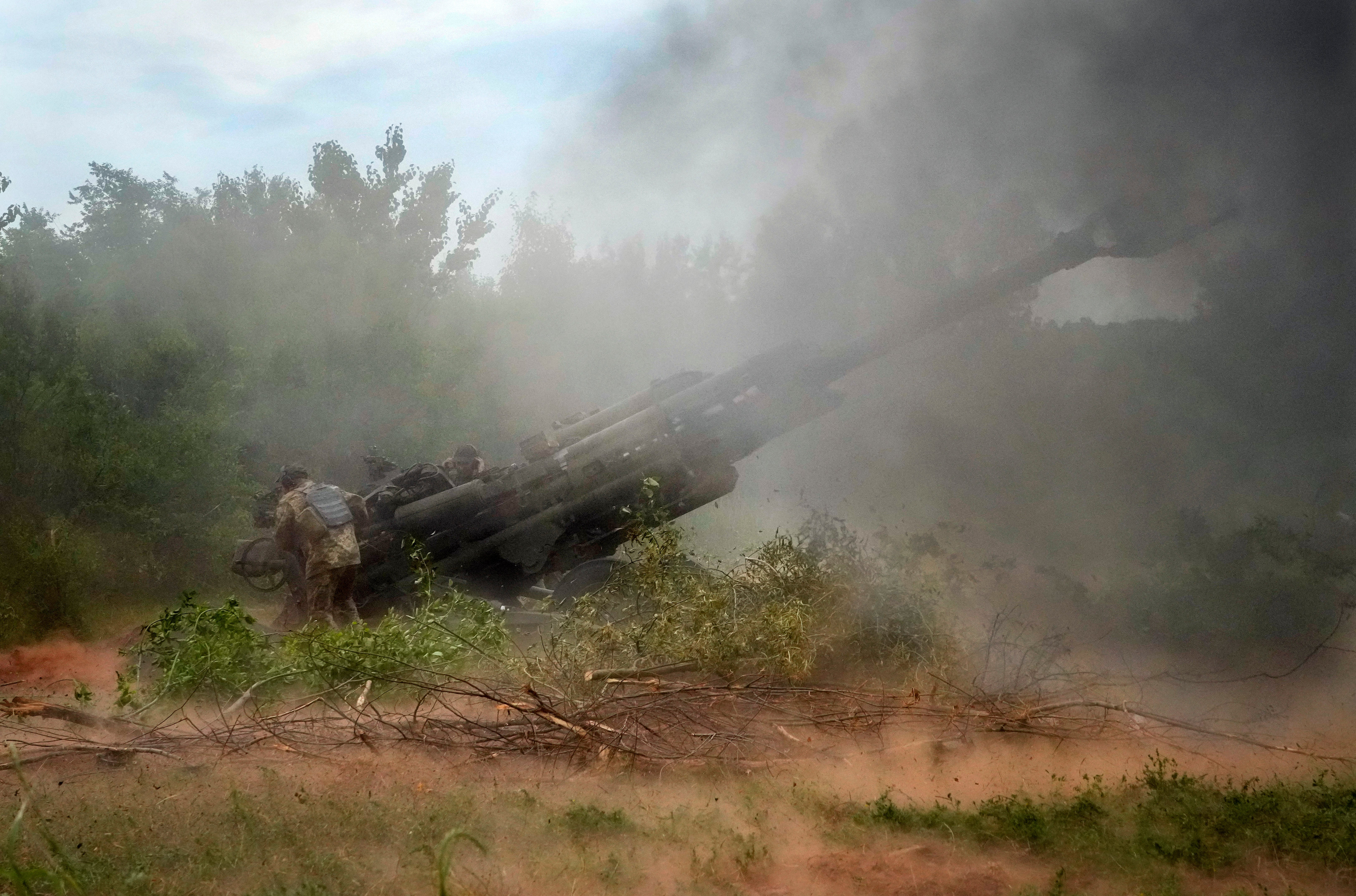 Ukrainian soldiers fire at Russian positions in Donetsk (Efrem Lukatsky/AP)
