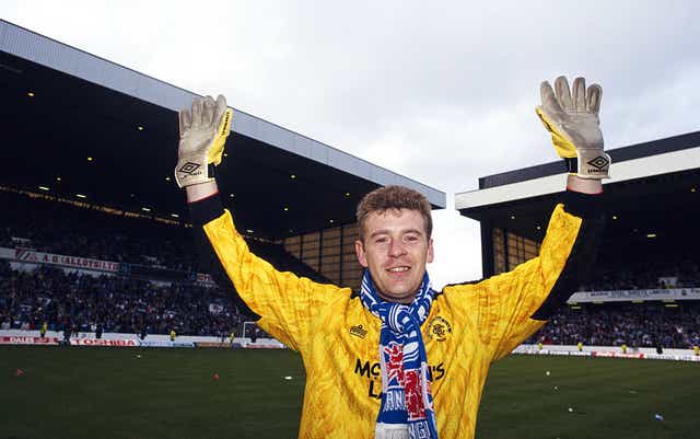 <p>Andy Goram celebrates after Rangers land the 1991/92 Scottish Premier Division title at Ibrox on 18 April 1992</p>