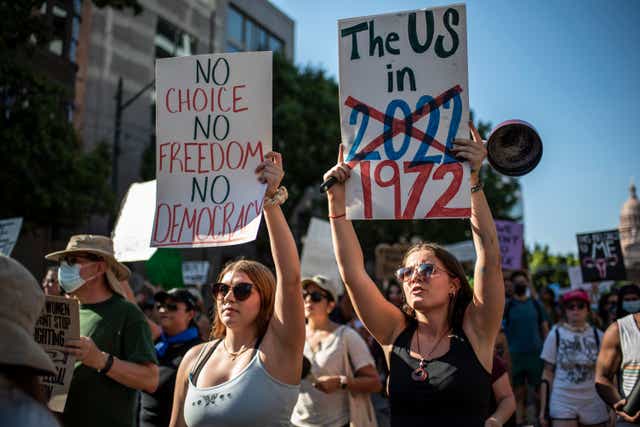 <p>AUSTIN, TX -JUNE 25: Protesters march while holding signs during an abortion-rights rally on June 25, 2022 in Austin, Texas. (Photo by Sergio Flores/Getty Images)</p>