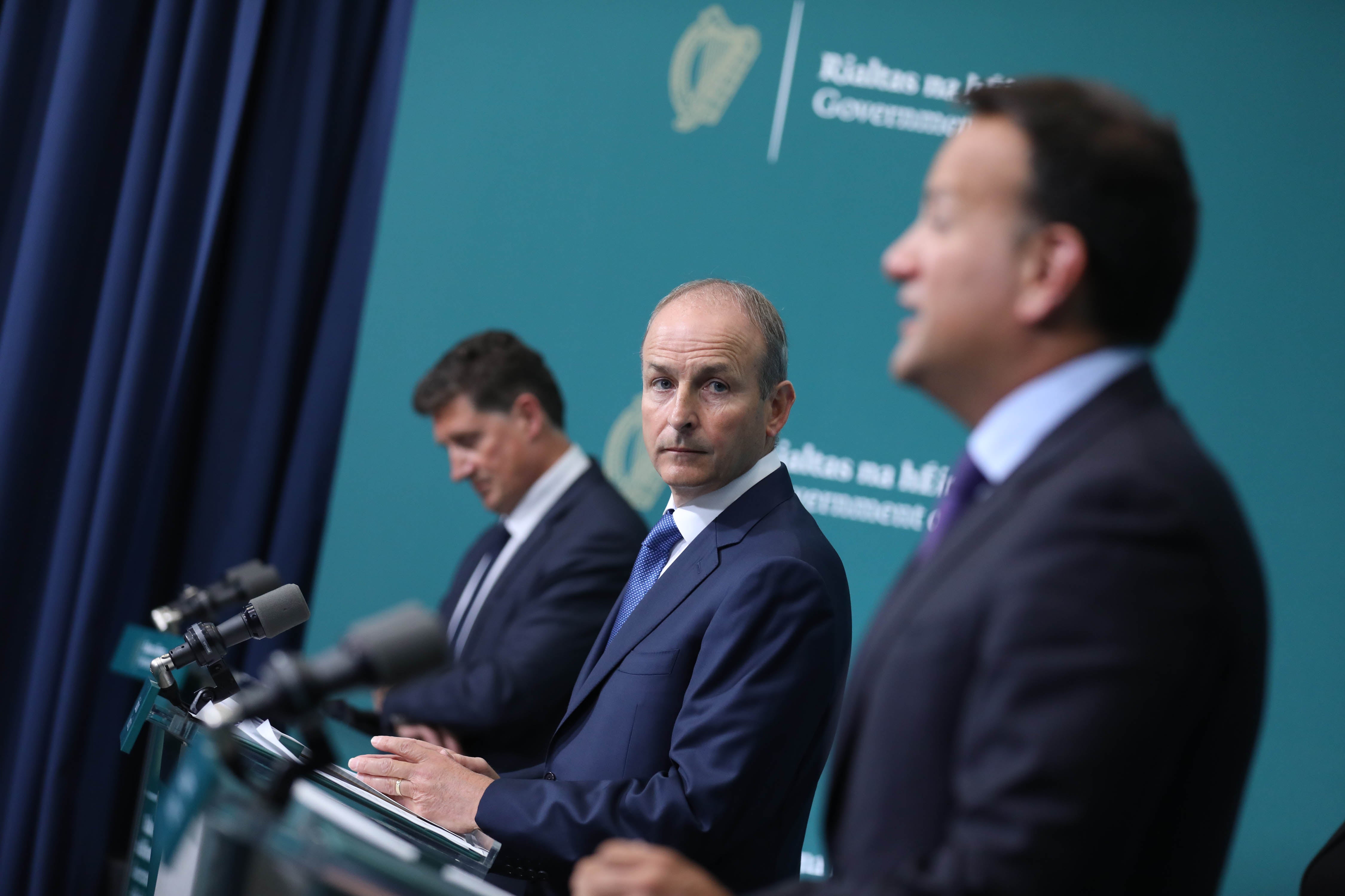 (left to right) Eamon Ryan Minister for the Environment Climate and Communications, Taoiseach Michael Martin and Tanaiste Leo Varadkar (PA)