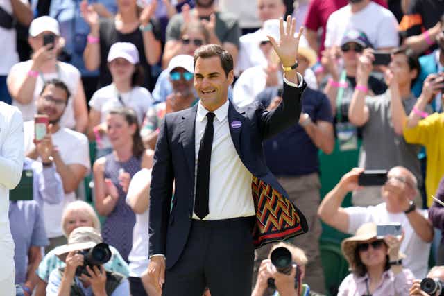 Roger Federer was given a rapturous reception on his return to Centre Court (Kirsty Wigglesworth/AP)