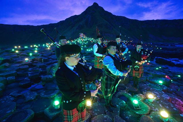<p>Lumenators create a large-scale art work at the Giant’s Causeway as part of Unboxed</p>