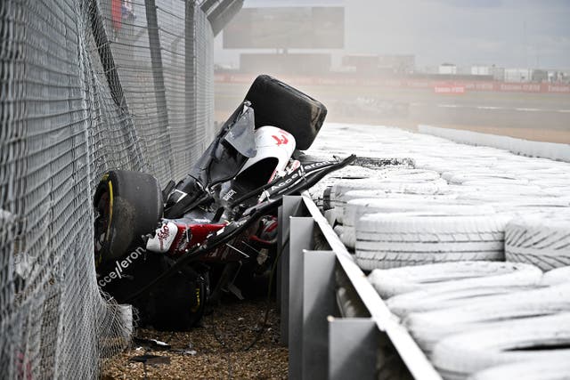 <p>Guanyu Zhou after his violent crash at Silverstone – trapped, but safe </p>
