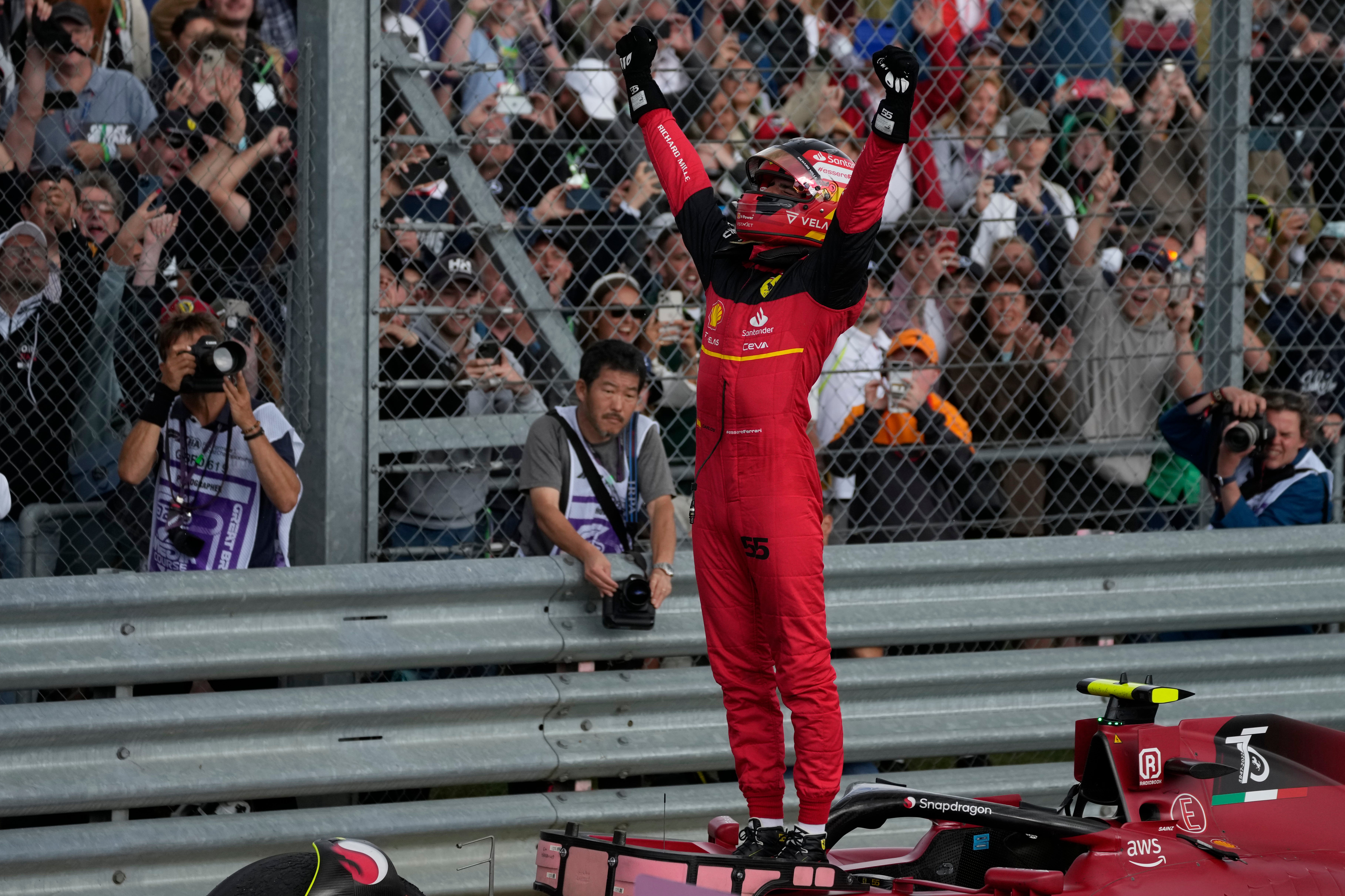 Ferrari driver Carlos Sainz of Spain celebrates