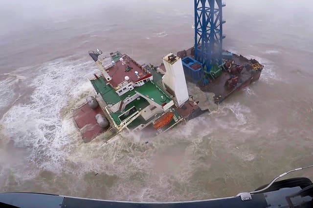 <p>A helicopter with rescue crew members approaches a sinking ship in the South China Sea, 300 kilometers (186 miles) south of Hong Kong </p>