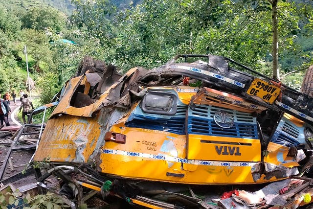 <p>The wreckage of a passenger that bus slid off a mountain road and fell into a deep gorge in Kullu, India on Monday</p>
