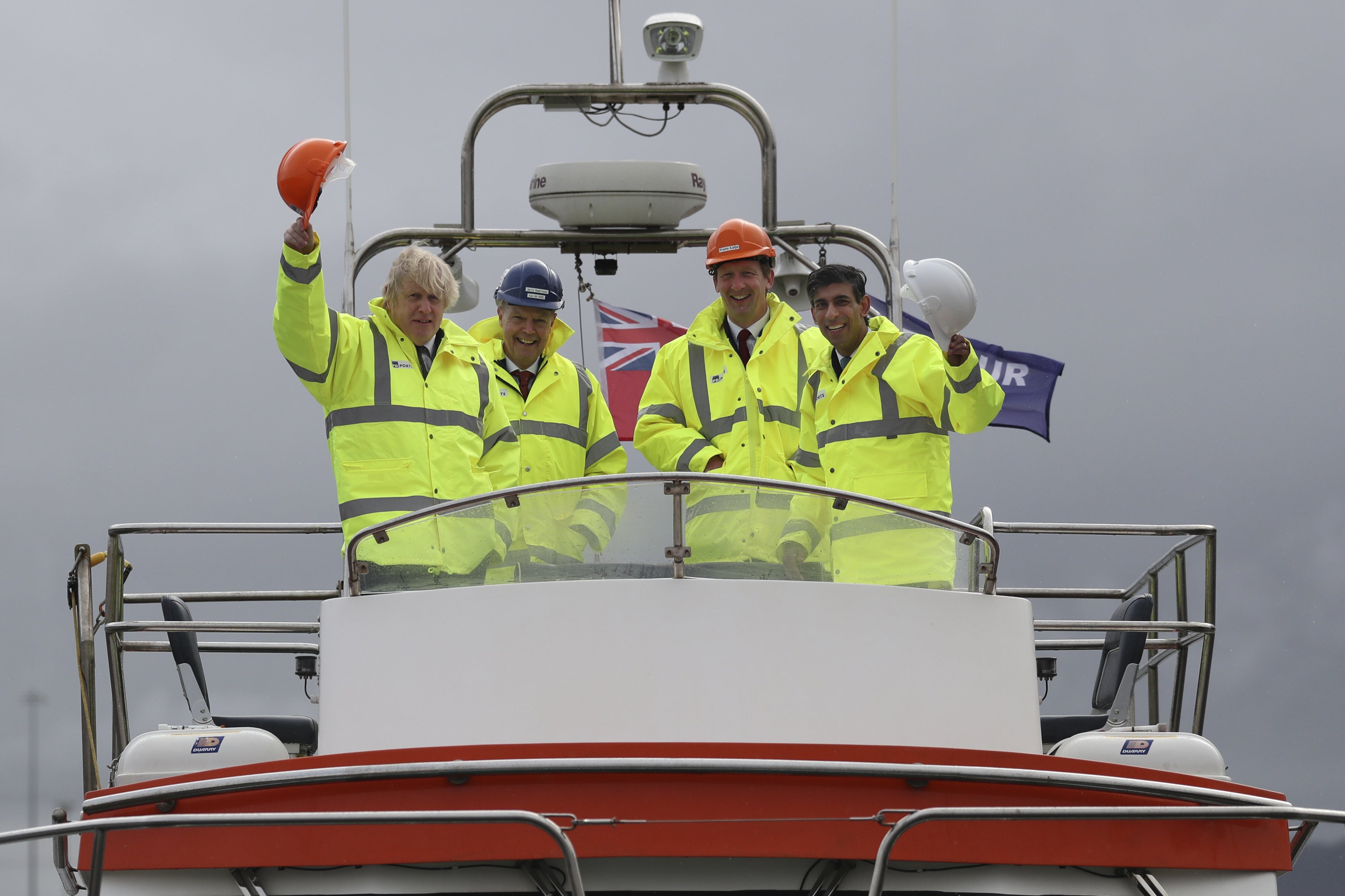 Boris Johnson, left, and Rishi Sunak, right, aboard a boat on the River Tees during a visit to Teesport in Middlesbrough in March 2021