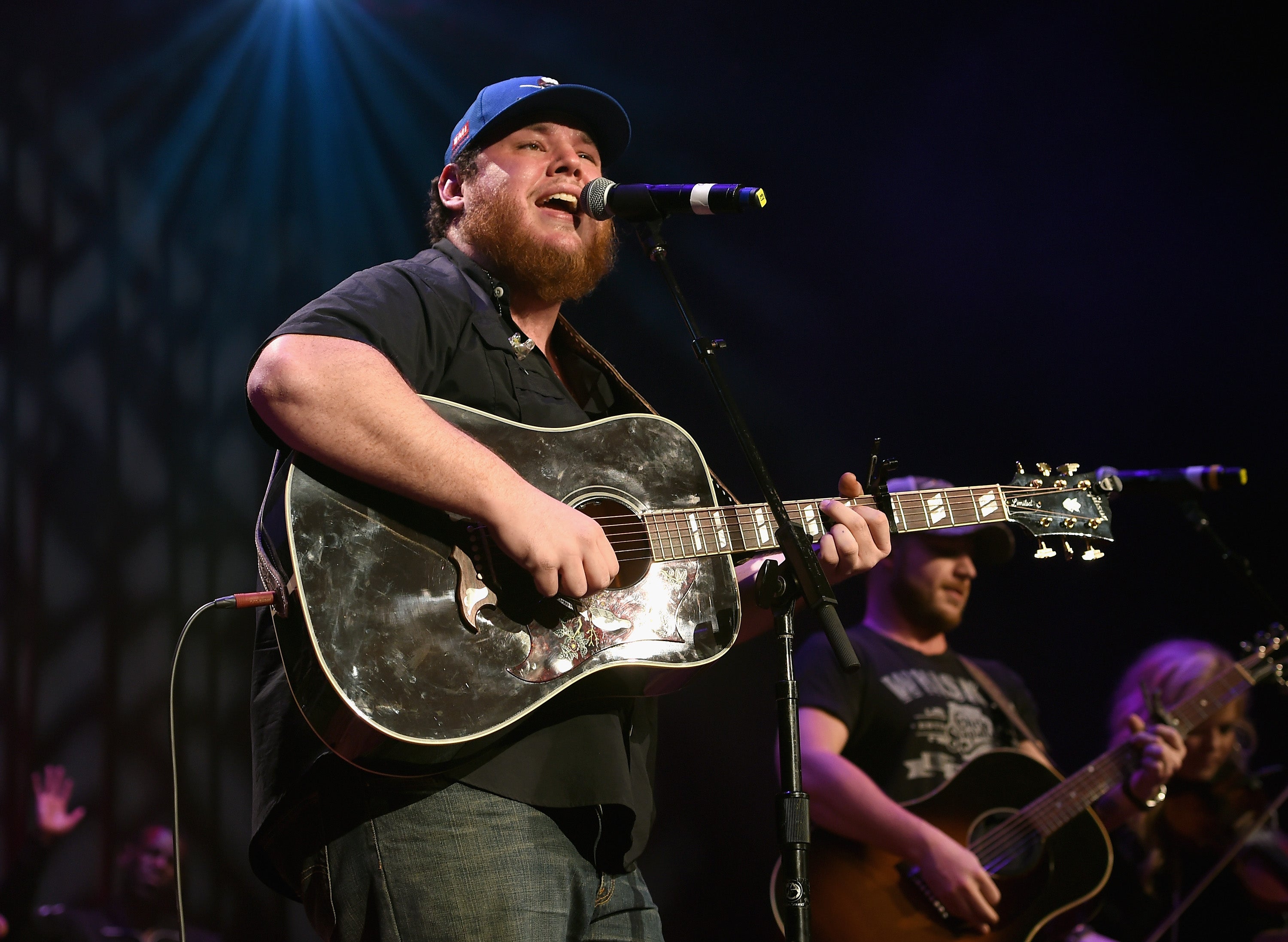 Luke Combs performing live in 2018