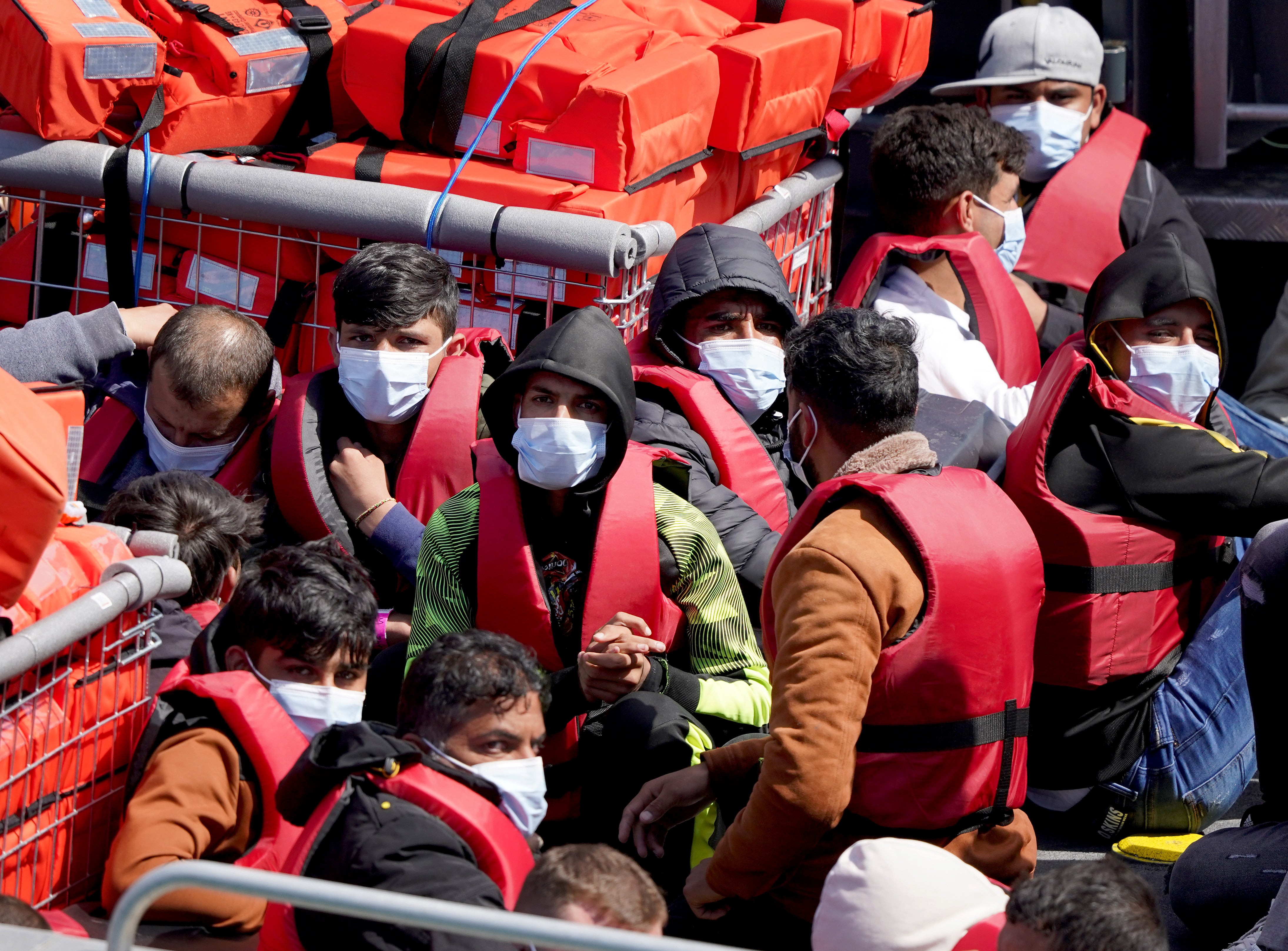 A group of people thought to be migrants are brought in to Dover, Kent, on Monday July 4 2022 (Gareth Fuller/PA)