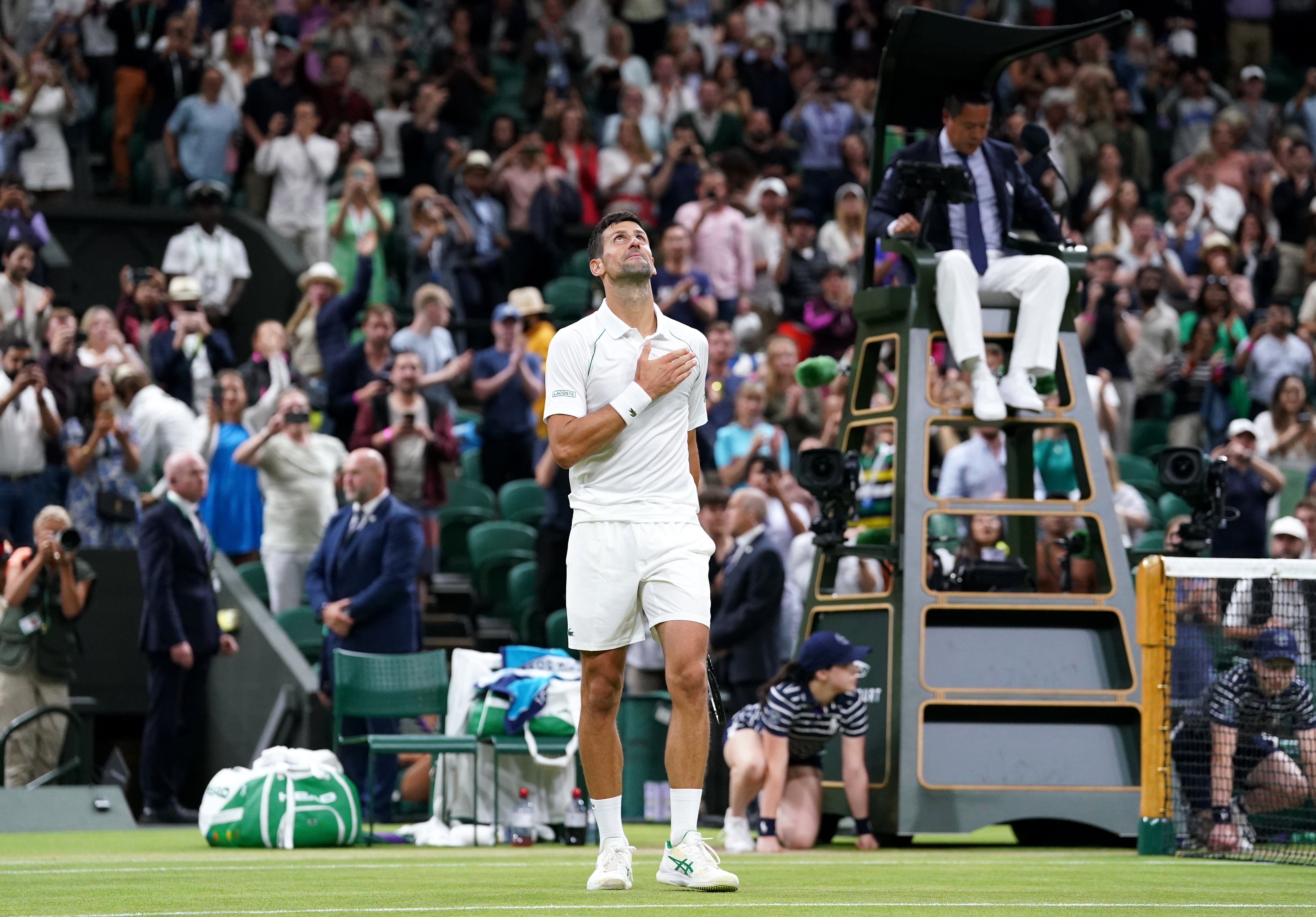 Novak Djokovic celebrates victory after his Gentlemen’s Singles fourth round match against Tim van Rijthoven during day seven of the 2022 Wimbledon Championships at the All England Lawn Tennis and Croquet Club, Wimbledon. (PA)