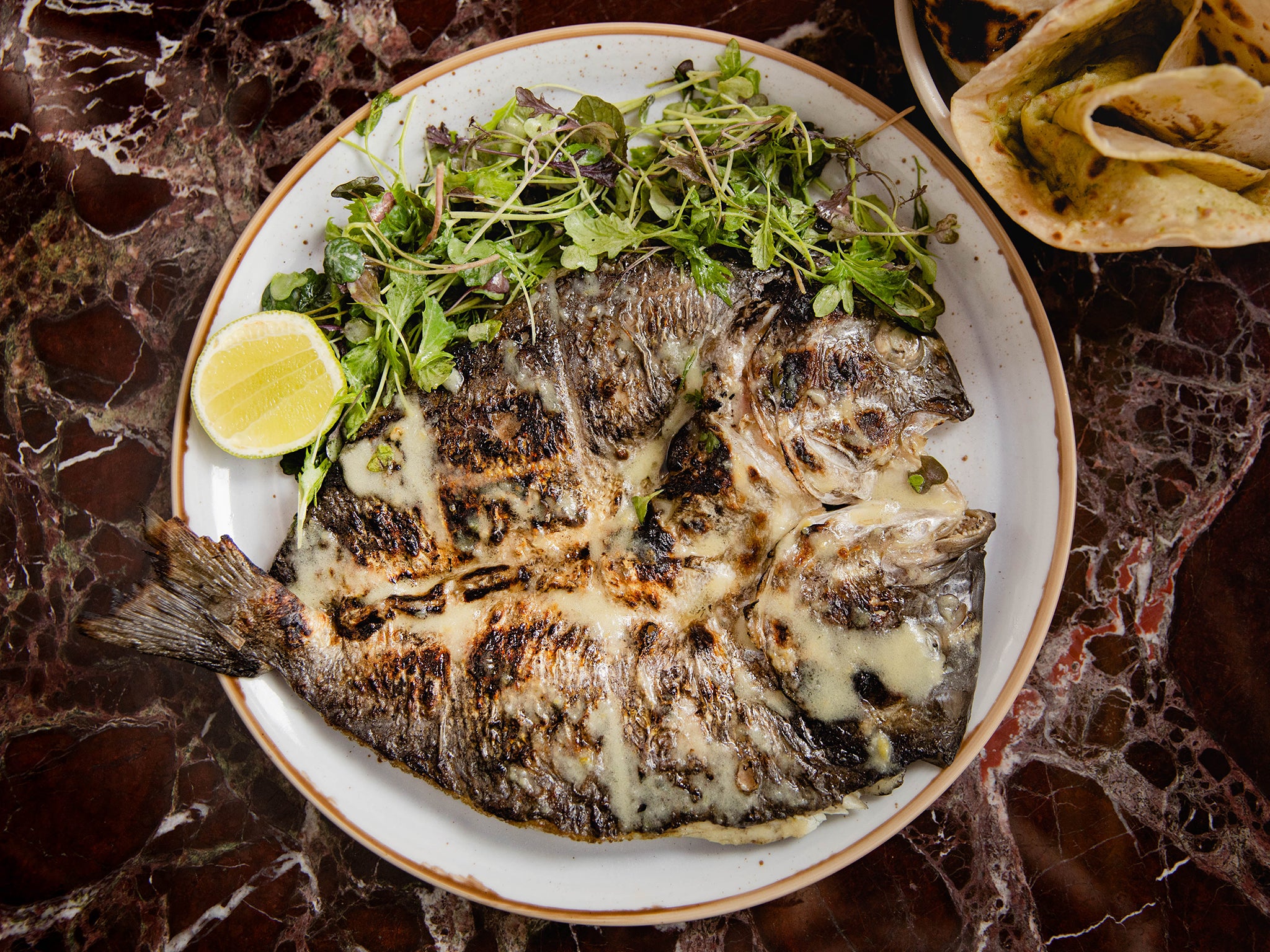 You won’t want to miss the whole bream with butter roti at Kudu Grill