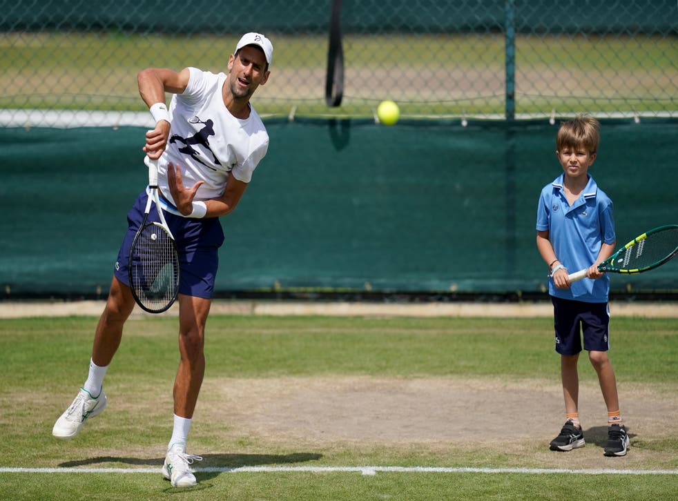 Novak Djokovic and his son Stefan during his practice session on day eight of the 2022 Wimbledon Championships (John Walton/PA)