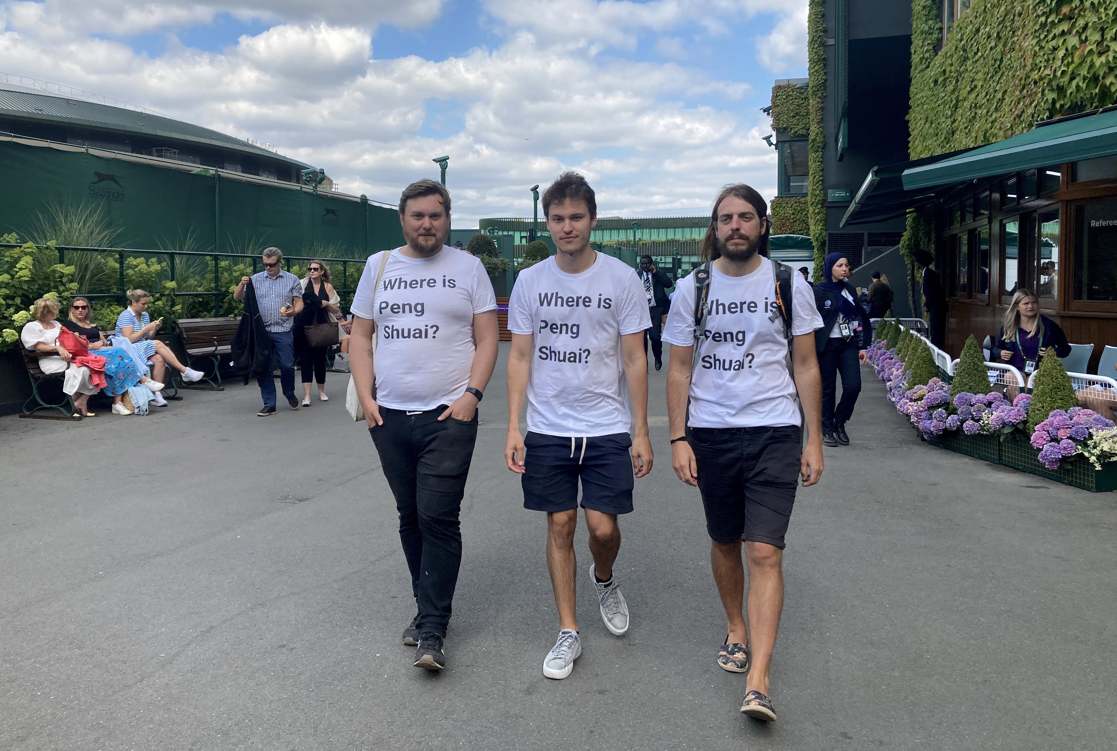 Protesters (left to right) Will Hoyles, 39, Caleb Compton, 27, and Jason Leith, 34, who all work for Free Tibet who have come to Wimbledon to draw attention to Peng Shuai. Picture date: Monday July 4, 2022.