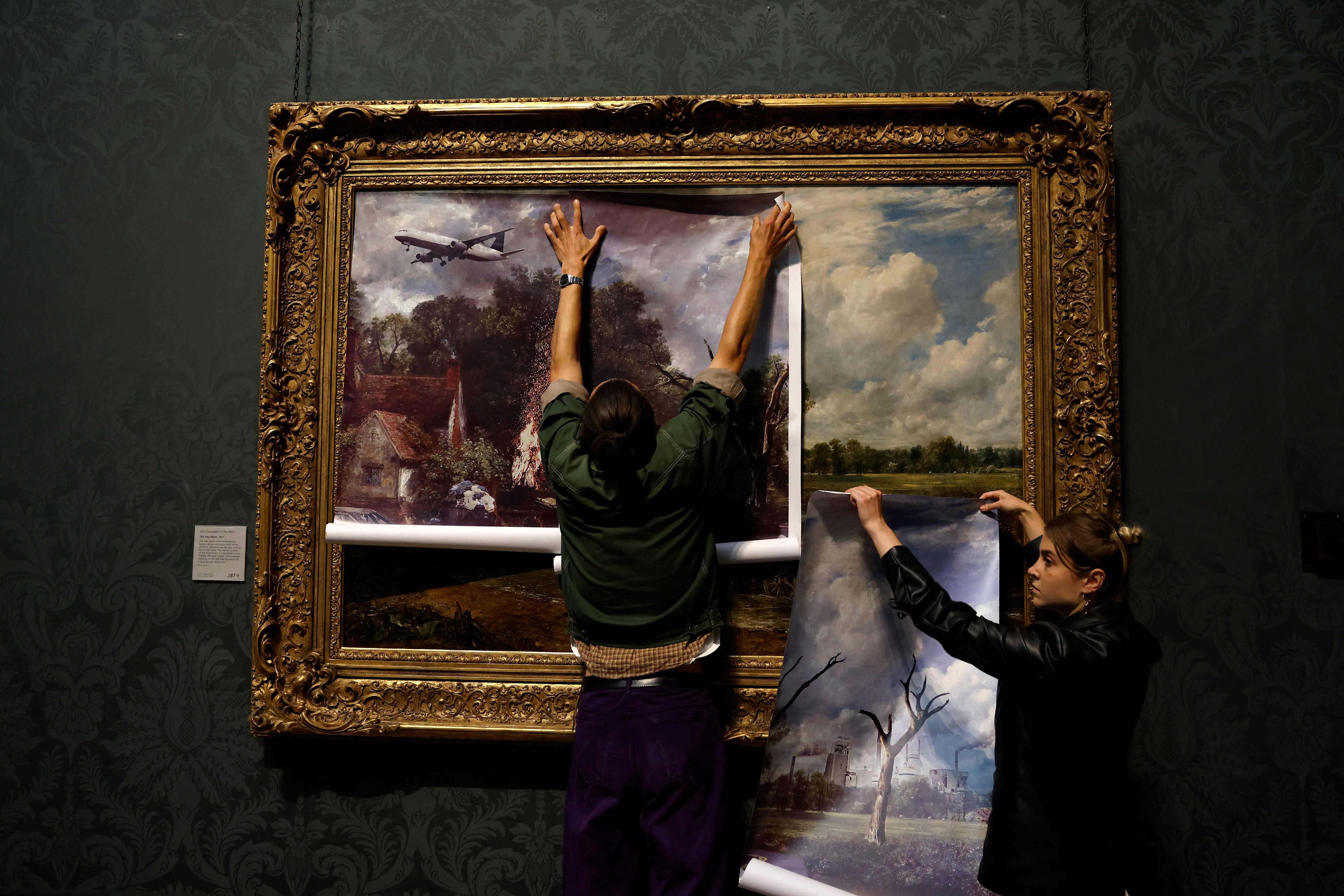Activists from the 'Just Stop Oil' campaign group cover 'The Hay Wain' painting by English artist John Constable