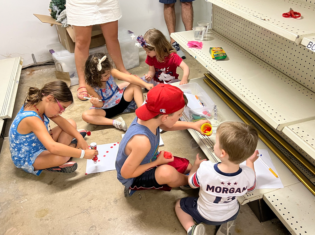 Heartbreaking photo shows children colouring on shop floor as they hide from active shooter in Highland Park