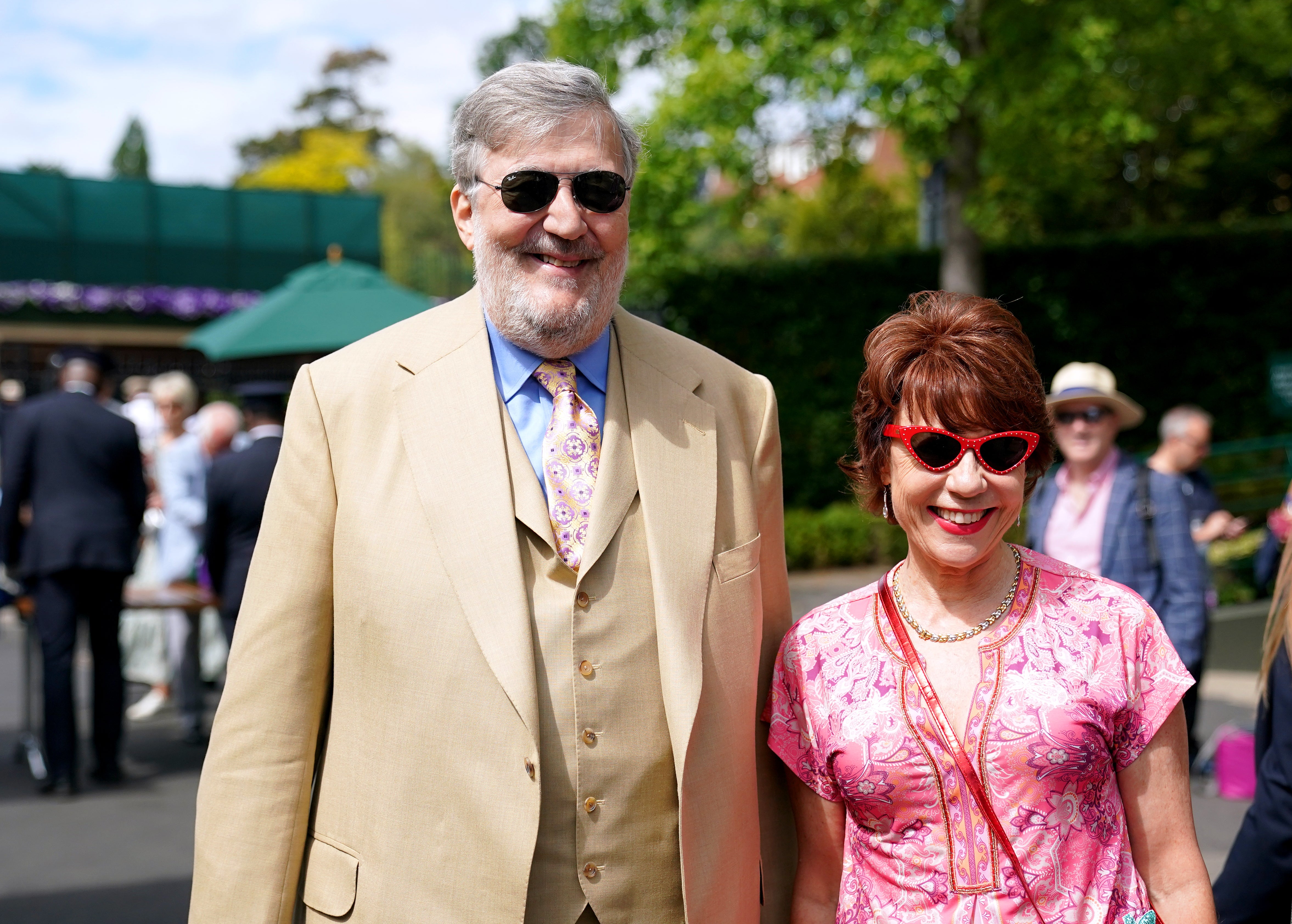 Stephen Fry and Kathy Lette arrive on day eight of the 2022 Wimbledon Championships (Zac Goodwin/PA)