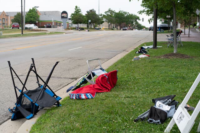 <p>Abandonned lawn chairs stand at the scene of the Fourth of July parade shooting in Highland Park, Illinois</p>