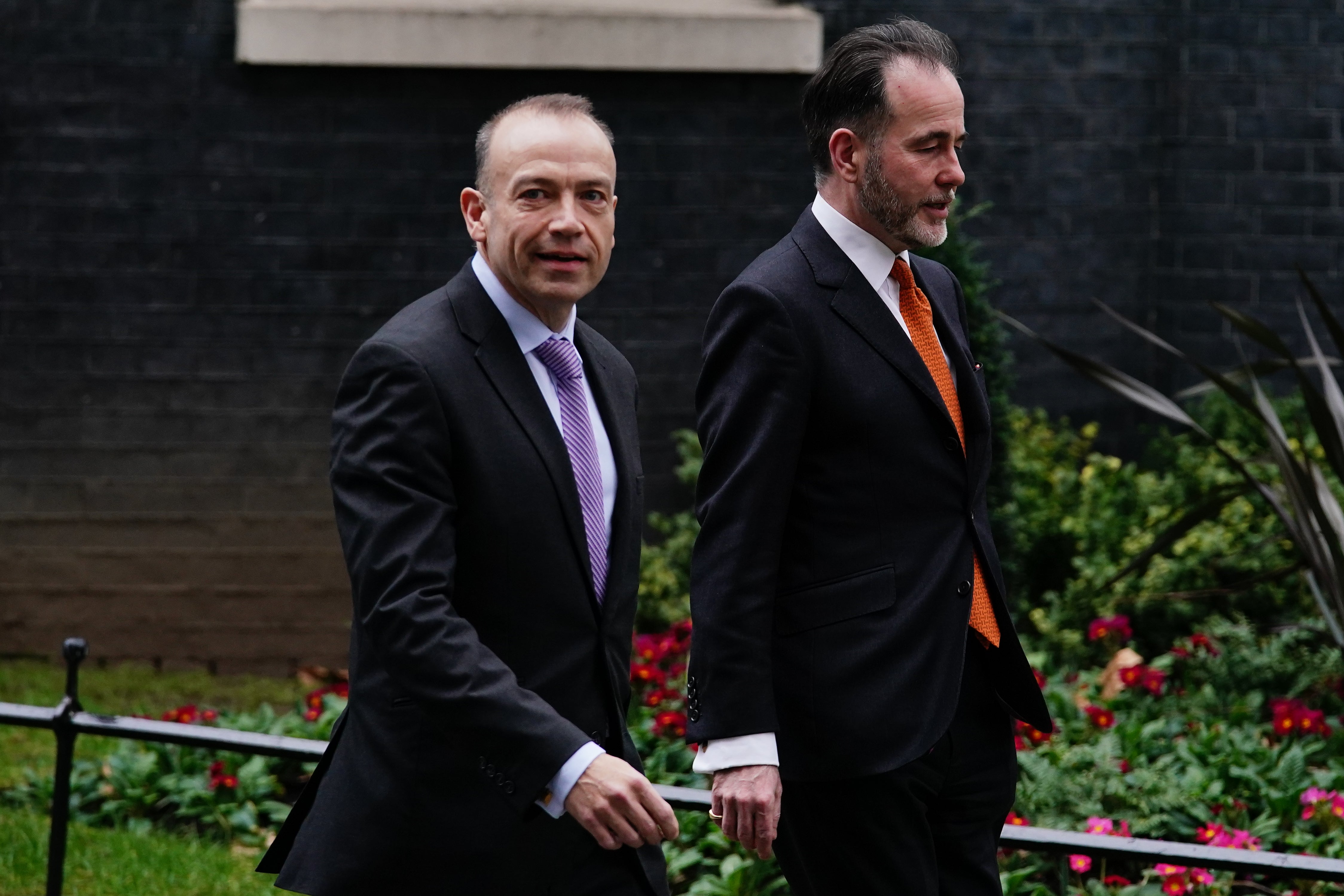 Chris Pincher (right) leaves Downing Street with chief whip Chris Heaton-Harris following their appointment in February (Aaron Chown/PA)