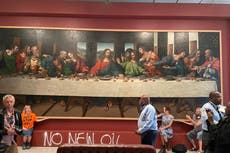 Just Stop Oil activists glue themselves to The Last Supper at Royal Academy