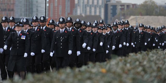 <p>Metropolitan Police recruits marching during a Metropolitan Police passing out parade for new officers at Peel House in Hendon (Nick Ansell/PA)</p>