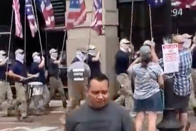 <p>Right-wing extremist group Patriot Front marches through Boston carrying flags. Members of the group have been accused of assaulting a Black man who was trying to film them during their march. </p>