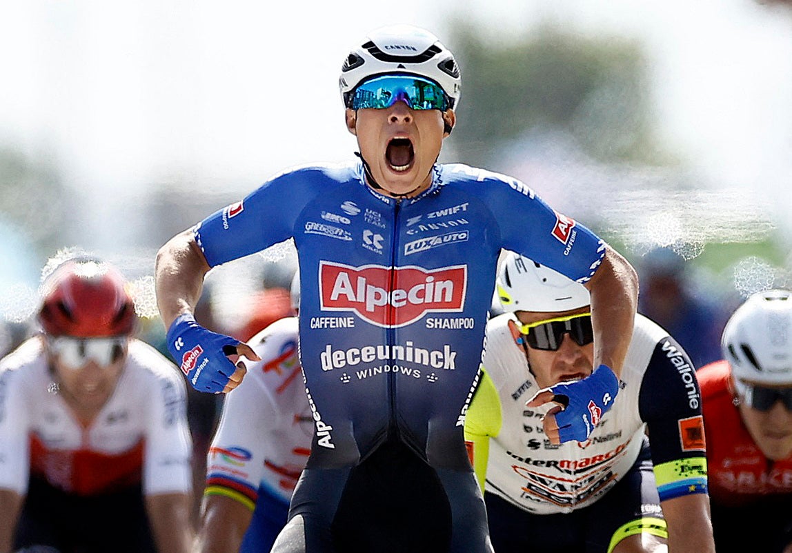 Jasper Philipsen celebrates, thinking he has won stage four