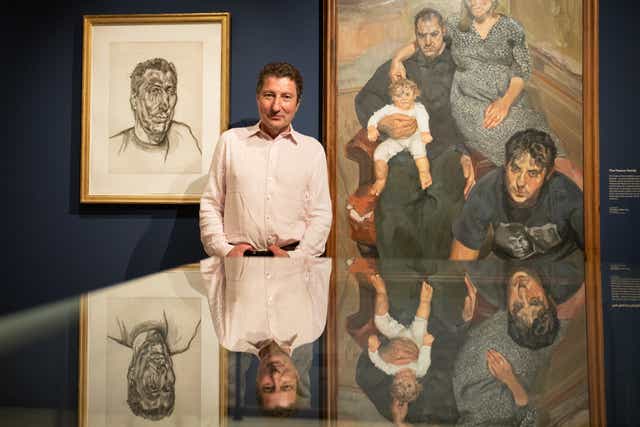Alex Boyt, son of Lucian Freud, stands in front of a portrait of himself called Head of Ali painted by his father at the Freud Museum in London (Stefan Rousseau/PA)