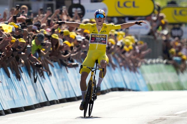 Wout Van Aert gave himself time to celebrate his solo win in Calais (Thibault Camus/AP)