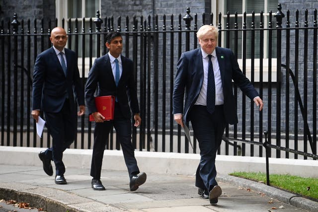 <p>Sajid Javid, Rishi Sunak and Prime Minister Boris Johnson (Toby Melville/PA)</p>