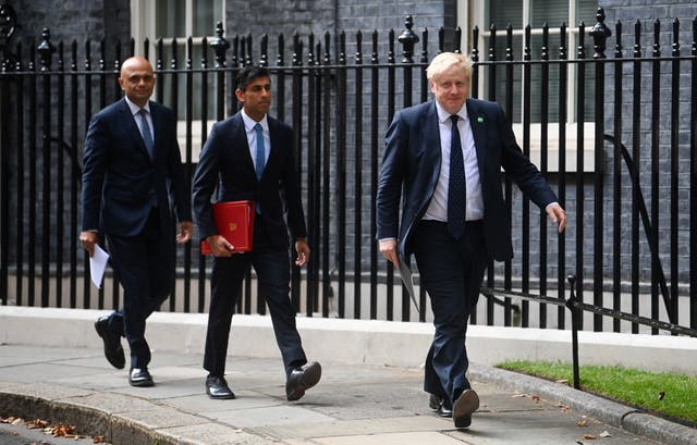 <p>Sajid Javid, Rishi Sunak and Prime Minister Boris Johnson (Toby Melville/PA)</p>