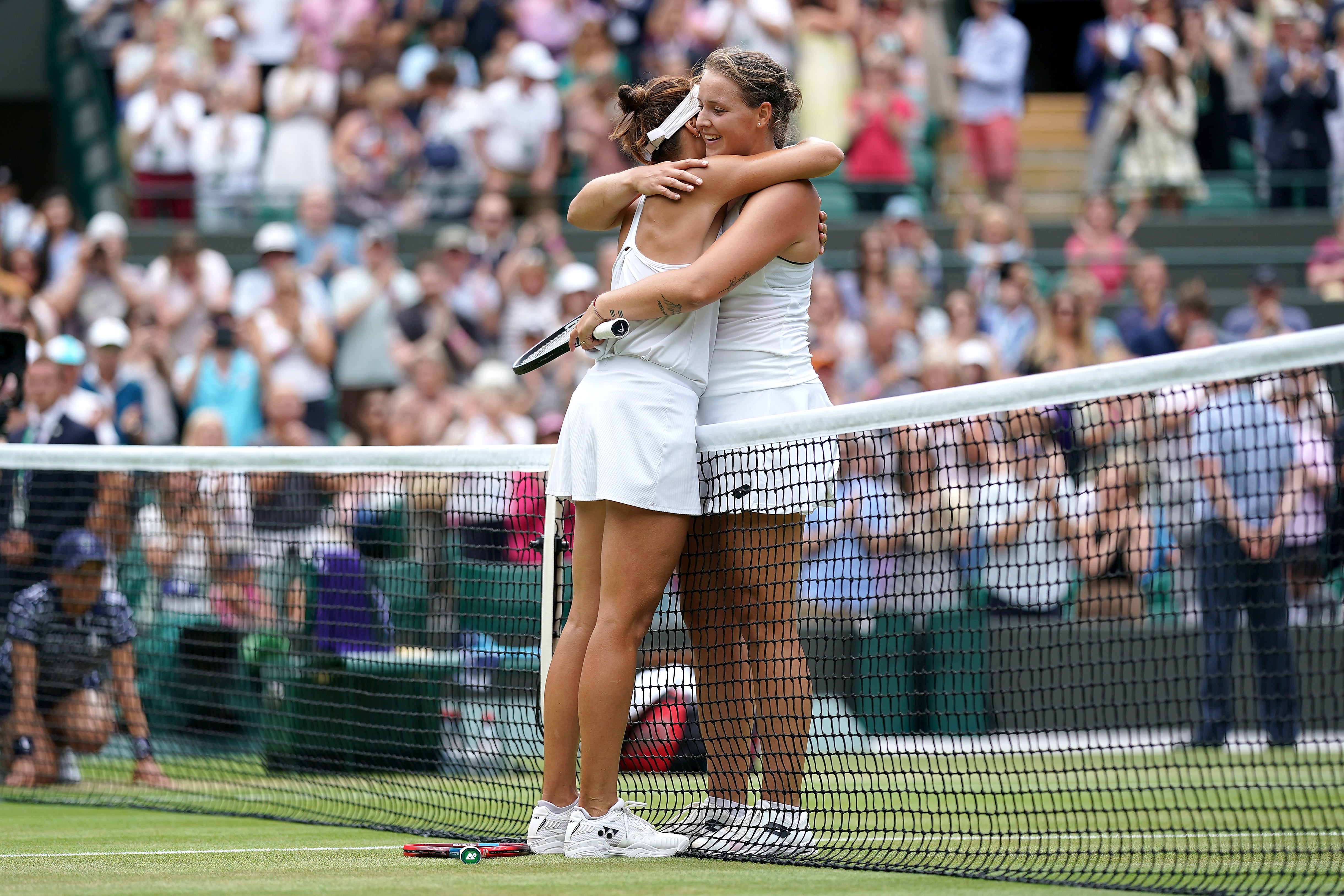 Germany’s Tatjana Maria shared a long hug with compatriot Jule Niemeier after they produced an epic back and forth quarter-final tie on Court One (Zac Goodwin/PA)