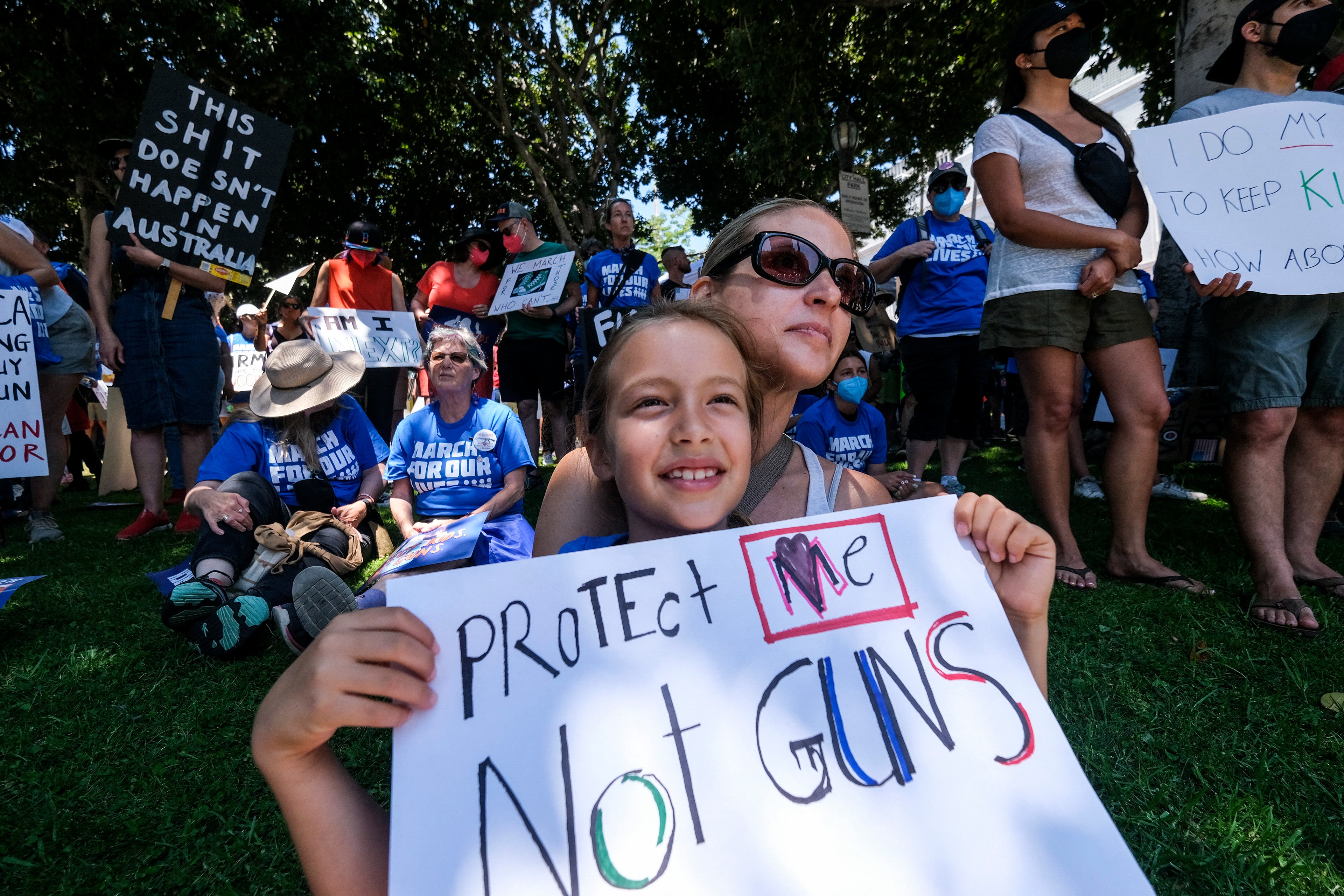 Protesters join the March for Our Lives rally for tighter firearm laws in LA, June