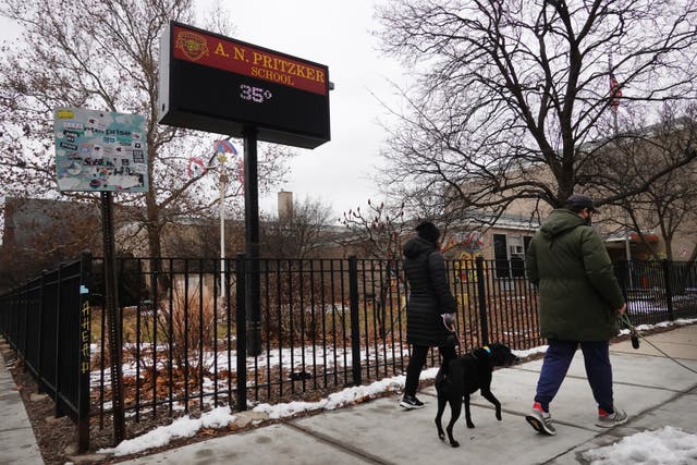 <p>People walk their dogs in the Wicker Park neighbourhood in Chicago, Illinois</p>