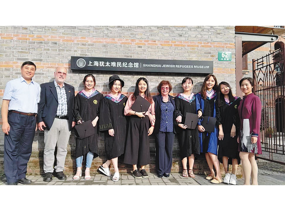 Sonja Mühlberger (fifth from right) and her brother Peter Krips (second from left) with Chen Jian (first left), director of the Shanghai Jewish Refugees Museum, and university students working as volunteers at the museum, in 2019