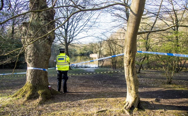 Metropolitan Police officers at the scene at the Wake Valley pond in Epping Forest following the discovery of Richard Okorogheye’s body. Picture date: Tuesday April 6, 2021 (Ian West/PA)