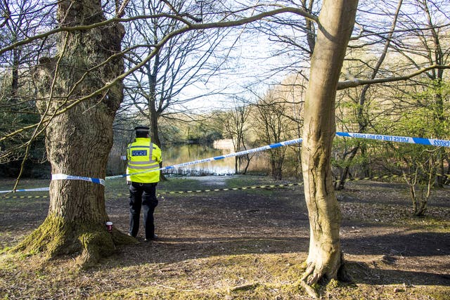 Metropolitan Police officers at the scene at the Wake Valley pond in Epping Forest following the discovery of Richard Okorogheye’s body. Picture date: Tuesday April 6, 2021 (Ian West/PA)