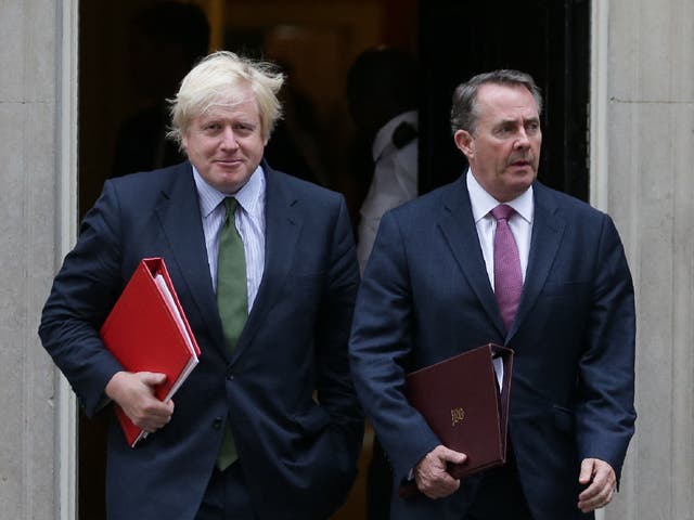 <p>Liam Fox (right) has urged Boris Johnson (left) to resign as prime minister</p>