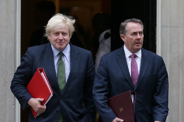 <p>Liam Fox (right) has urged Boris Johnson (left) to resign as prime minister</p>