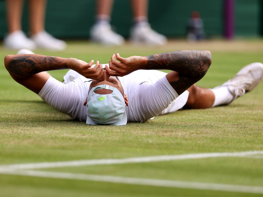 Nick Kyrgios collapses on the court after sealing victory