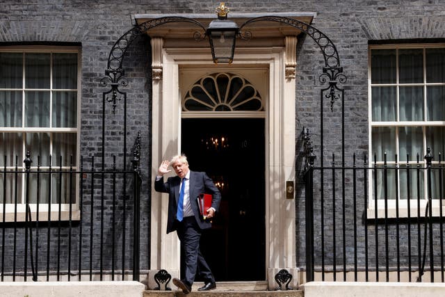 <p>Boris Johnson leaves Downing Street on Wednesday – only to return later </p>