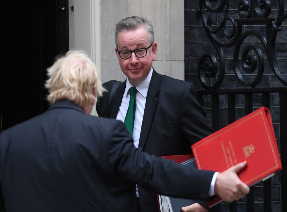Michael Gove and Boris Johnson arrive in Downing Street (PA)