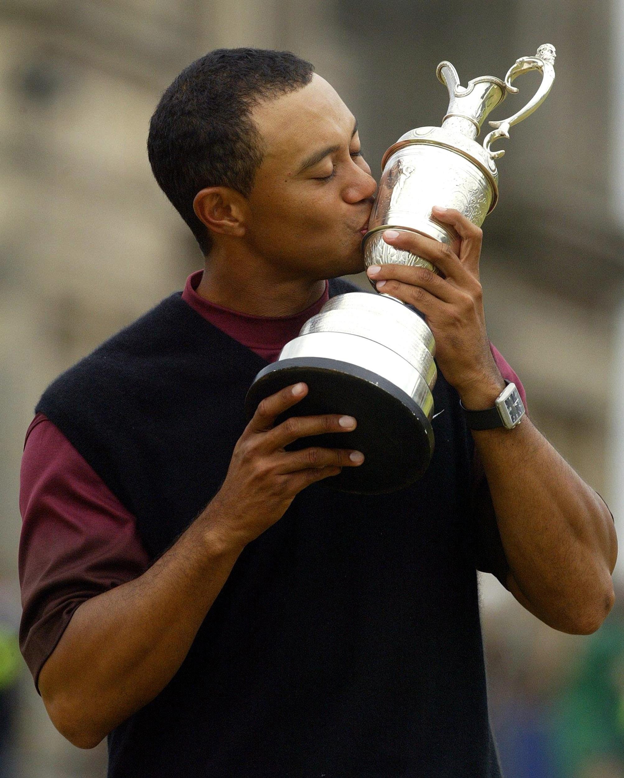 Tiger Woods kissed the Claret Jug after winning the 134th Open Championship at St Andrews (Gareth Fuller/PA)