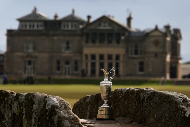 The Claret Jug sits by the Swilcan Bridge in front of the R&A clubhouse at St Andrews (PA Archive)
