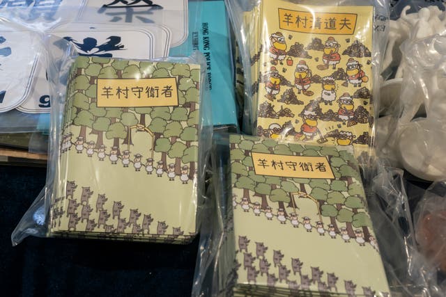 <p>Children’s books are pictured during a press conference on 22 July 2021 after five people were arrested under suspicion of conspiring to publish seditious material</p>