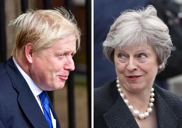 File photos of Boris Johnson and Theresa May (PA)