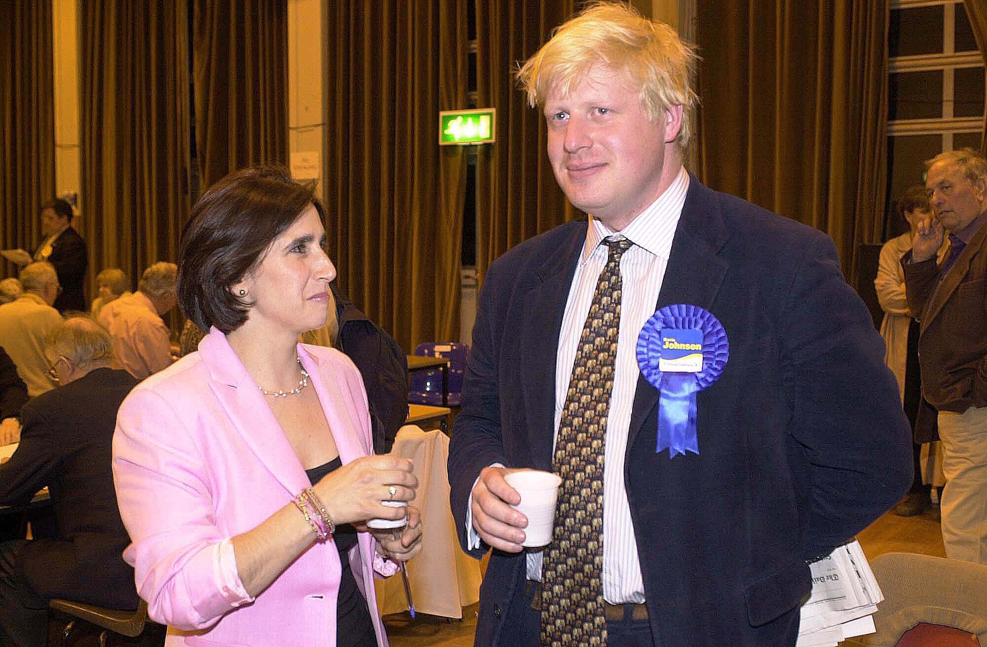 Conservative candidate for Henley, journalist Boris Johnson, and his wife Marina have a drink as they wait during the count at Watlington for the Henley seat (Tim Ockenden/PA)