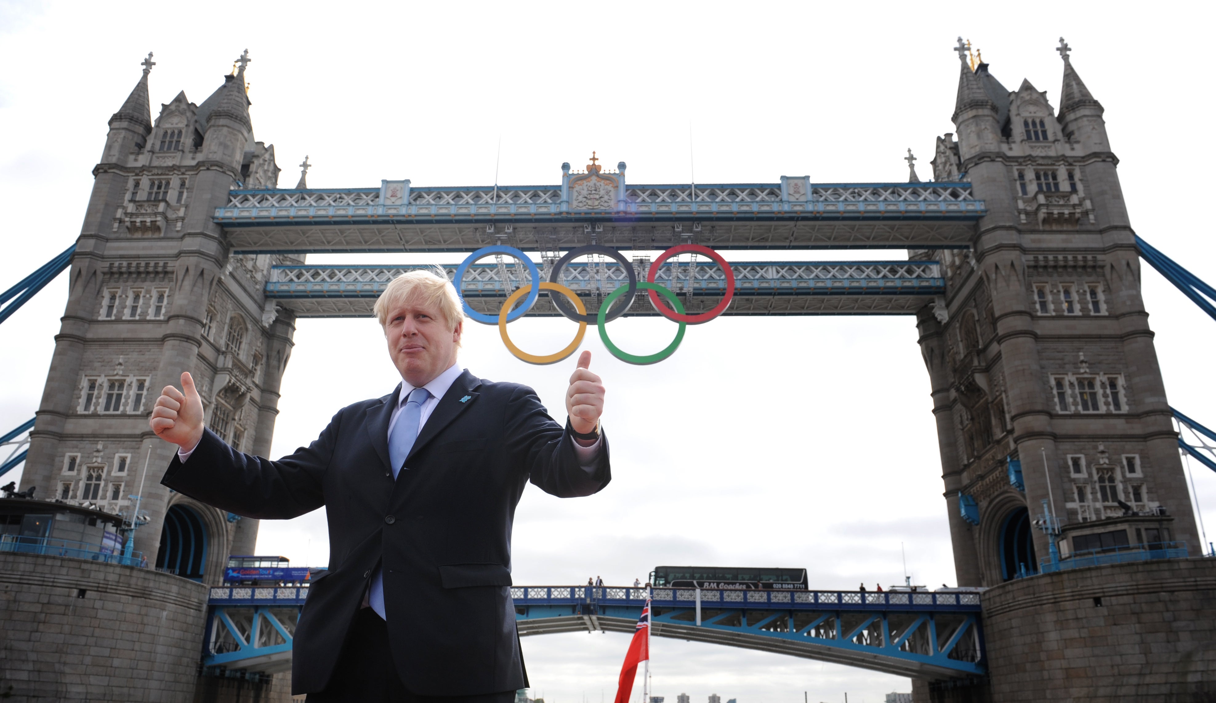 Then London mayor Boris Johnson in front of Tower Bridge in London where the Olympic rings were hung (Stefan Rousseau/PA)