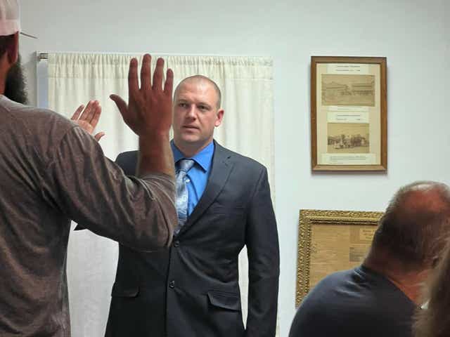 <p>Officer Timothy Loehmann is sworn in by Tioga Mayor David Wilcox</p>
